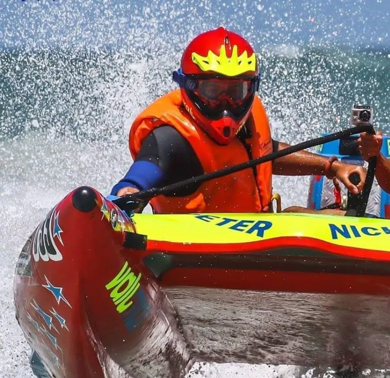 Pilot and co-pilot racing at speed with spray flying